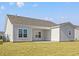 The backyard features a patio and a well-manicured lawn at 3336 Little Bay Dr., Conway, SC 29526