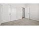 Bedroom with carpet, closet with folding doors and view to hallway at 3336 Little Bay Dr., Conway, SC 29526