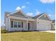 Charming single-Gathering home with a two-car garage, covered porch and manicured lawn at 3336 Little Bay Dr., Conway, SC 29526