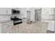 Modern kitchen featuring stainless steel appliances, granite countertops, and a stylish tile backsplash at 3336 Little Bay Dr., Conway, SC 29526
