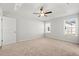 Spacious bedroom features plush carpeting, two windows with views, and a ceiling fan at 343 Barn Owl Way, Conway, SC 29527
