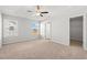 Large bedroom with plush carpet, two windows and access to a walk-in closet at 343 Barn Owl Way, Conway, SC 29527