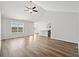 Open-concept living room with wood floors, high ceilings, and lots of natural light at 343 Barn Owl Way, Conway, SC 29527