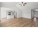 Inviting living room with modern finishes, wood floors, and an open layout to the kitchen at 343 Barn Owl Way, Conway, SC 29527