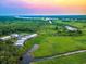 Breathtaking aerial view of the community, marsh, and surrounding landscape at 35 Red Skiff Ln. # 35, Pawleys Island, SC 29585