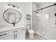 Sleek bathroom featuring a glass enclosed shower, round mirror and modern vanity at 35 Red Skiff Ln. # 35, Pawleys Island, SC 29585