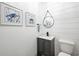 Charming powder room with shiplap walls and stylish fixtures and decor at 35 Red Skiff Ln. # 35, Pawleys Island, SC 29585