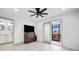 Bedroom with ceiling fan, a door to a screened porch and an ensuite bathroom at 35 Red Skiff Ln. # 35, Pawleys Island, SC 29585