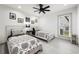 Cozy bedroom with twin beds, ceiling fan, and a window with natural light at 35 Red Skiff Ln. # 35, Pawleys Island, SC 29585