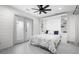 Bright bedroom with a murphy bed, built-in shelving, shiplap wall, and access to the screened porch at 35 Red Skiff Ln. # 35, Pawleys Island, SC 29585