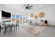 Open living room with a fireplace and large windows offering scenic views at 35 Red Skiff Ln. # 35, Pawleys Island, SC 29585