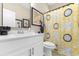 Bathroom showcasing a stylish sunflower shower curtain, a modern vanity, and contemporary fixtures at 363 Cypress Springs Way, Little River, SC 29566