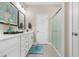 Clean bathroom with double vanity, bright mirrors, great lighting, and a glass enclosed shower at 363 Cypress Springs Way, Little River, SC 29566