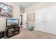 Bright bedroom with neutral walls, television, and closet space at 363 Cypress Springs Way, Little River, SC 29566