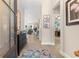 Inviting entryway features tile flooring, neutral walls, and views into the living area at 363 Cypress Springs Way, Little River, SC 29566