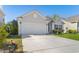Charming single-story home with a well-manicured lawn, a two-car garage, and a lovely front yard at 363 Cypress Springs Way, Little River, SC 29566