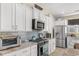 Updated kitchen with stainless steel appliances, granite counters, modern tile backsplash and ample storage at 363 Cypress Springs Way, Little River, SC 29566