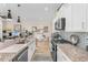Kitchen with stainless steel appliances, granite counters, and an eat-in bar at 363 Cypress Springs Way, Little River, SC 29566