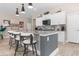 Island kitchen featuring granite counters, white cabinets, and stainless steel appliances at 363 Cypress Springs Way, Little River, SC 29566