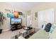 Inviting living room featuring beach-themed decor, a television, and comfortable seating at 363 Cypress Springs Way, Little River, SC 29566