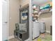 Well-organized mudroom and laundry area with storage, seating, and modern appliances at 363 Cypress Springs Way, Little River, SC 29566