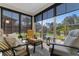 Relaxing sunroom with comfortable seating and great views of backyard pond at 363 Cypress Springs Way, Little River, SC 29566