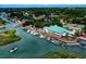 Aerial view of a waterfront restaurant with boats docked along the river and lush surroundings at 400 Woodpecker Ln. # 17B, Murrells Inlet, SC 29576