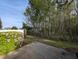 Landscaped backyard with flower bushes and a backdrop of mature trees providing privacy at 400 Woodpecker Ln. # 17B, Murrells Inlet, SC 29576