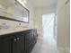 Bathroom featuring dual sinks with vanity and a separate shower and toilet room at 400 Woodpecker Ln. # 17B, Murrells Inlet, SC 29576