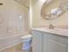 Bathroom featuring a vanity, decorative mirror and a shower-tub combo at 400 Woodpecker Ln. # 17B, Murrells Inlet, SC 29576