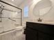 Well-lit bathroom featuring a modern vanity and glass enclosed shower with handicap bars at 400 Woodpecker Ln. # 17B, Murrells Inlet, SC 29576