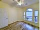 Bedroom features wood floors, ample natural light, and a neutral color scheme at 400 Woodpecker Ln. # 17B, Murrells Inlet, SC 29576