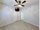 Bedroom with ceiling fan, wood-look flooring, and access to closet and other rooms at 400 Woodpecker Ln. # 17B, Murrells Inlet, SC 29576