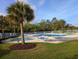 Sparkling community pool with ample lounge chairs and lush landscaping for relaxation at 400 Woodpecker Ln. # 17B, Murrells Inlet, SC 29576