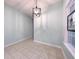 Dining room featuring contemporary lighting and a window with decorative stained glass at 400 Woodpecker Ln. # 17B, Murrells Inlet, SC 29576