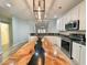 Bright modern kitchen with stainless steel appliances, granite counters, and a striking natural wood island at 400 Woodpecker Ln. # 17B, Murrells Inlet, SC 29576