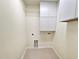 Laundry room includes shelving and cabinets at 400 Woodpecker Ln. # 17B, Murrells Inlet, SC 29576