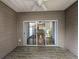 Covered patio with wood-look floor, ceiling fan, and a view of the interior at 400 Woodpecker Ln. # 17B, Murrells Inlet, SC 29576