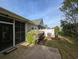 Cozy outdoor patio area with views of the manicured landscaping and home exterior at 400 Woodpecker Ln. # 17B, Murrells Inlet, SC 29576