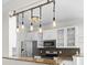 Close up view of a modern kitchen featuring granite counters, stainless appliances, and unique industrial style lighting at 405 Emerson Dr., Myrtle Beach, SC 29579