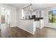 An open kitchen with stainless steel appliances, granite countertops, and modern lighting at 405 Emerson Dr., Myrtle Beach, SC 29579