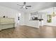 Open-concept living room featuring wood floors and a view of the kitchen with white cabinetry at 405 Emerson Dr., Myrtle Beach, SC 29579