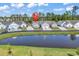 Aerial view of a gray home near a pond at 4061 Taranto Loop # A, Myrtle Beach, SC 29579