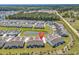 Community aerial view featuring lush landscaping, homes and a pond at 4061 Taranto Loop # A, Myrtle Beach, SC 29579