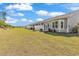 Grassy backyard view showcasing privacy fence, landscaping, and exterior home features at 4061 Taranto Loop # A, Myrtle Beach, SC 29579