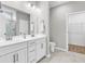 Contemporary bathroom featuring double sinks, granite countertops, and a walk-in closet at 4061 Taranto Loop # A, Myrtle Beach, SC 29579