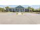 Community clubhouse with ample parking, decorative landscaping and a covered entry at 4061 Taranto Loop # A, Myrtle Beach, SC 29579