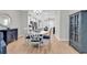 Open-concept dining room features a round table and seating with views into the modern kitchen at 4061 Taranto Loop # A, Myrtle Beach, SC 29579