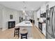 Open concept kitchen showcases a central island with seating, modern appliances, and white cabinetry at 4061 Taranto Loop # A, Myrtle Beach, SC 29579