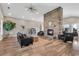 Inviting living room features a floor-to-ceiling stone fireplace, modern furniture, and wood-look floors at 4061 Taranto Loop # A, Myrtle Beach, SC 29579